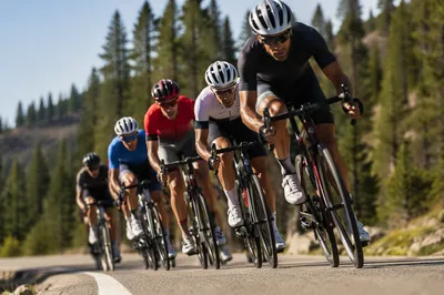 Road Cyclists Racing Uphill on Mountain Bend