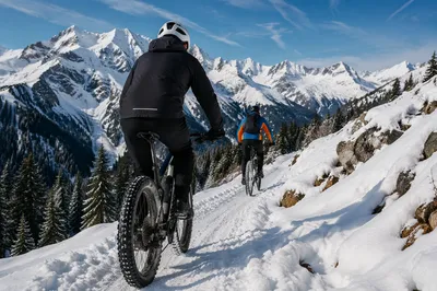 Winter Cyclists on Snowy Mountain Trail