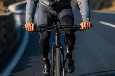Mountain Road Cyclist in Morning Motion