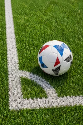 Soccer Ball on Green Corner Field