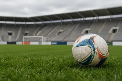 Soccer Ball on Dewy Stadium Grass