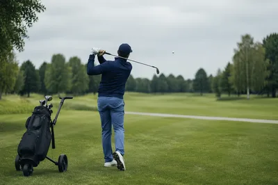 Golfer Follow Through on Green Fairway
