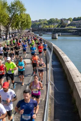 City Marathon Runners by Riverside Street