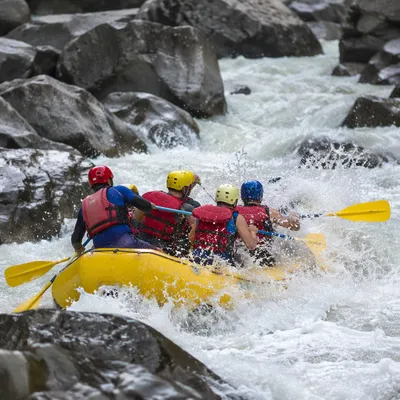 Yellow Raft Charging Through White Water