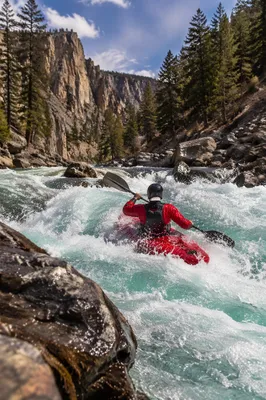 Solo Kayaker Charging Through White Water Rapids