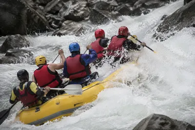 White Water Rafting Through River Rapids