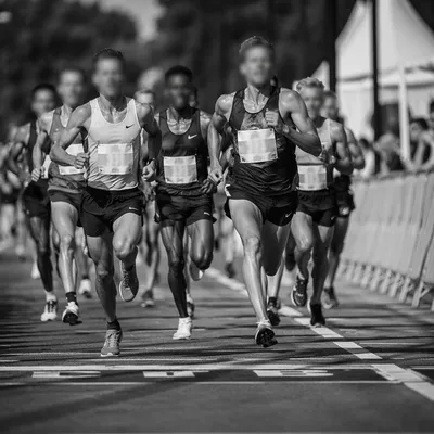 Marathon Runners Sprinting Toward Finish Line