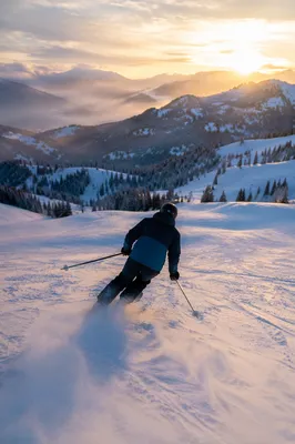 Golden Hour Skier on Snowy Slope