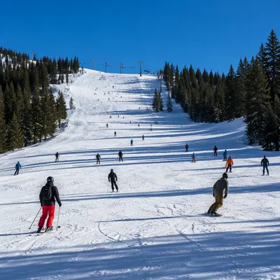 Busy Downhill Ski Slope in Winter