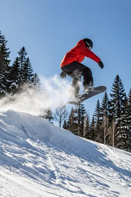 Red Jacket Snowboarder Mountain Jump