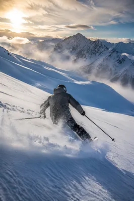 Lone Skier on Dramatic Winter Descent
