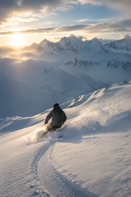 Lone Skier on Misty Alpine Descent