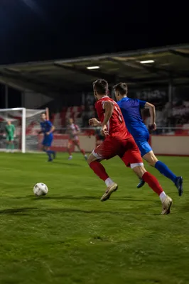 Night Soccer Match on Green Stadium Field