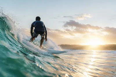 Sunrise Surfer Riding Turquoise Ocean Wave