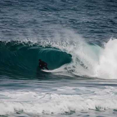 Surfer Carving Inside Turquoise Ocean Wave