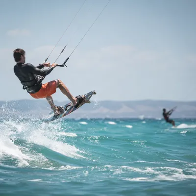 Kitesurfer Jumping Over Summer Ocean Wave