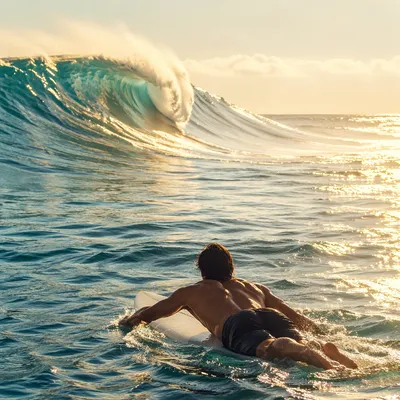 Surfer Paddling Toward Turquoise Morning Wave