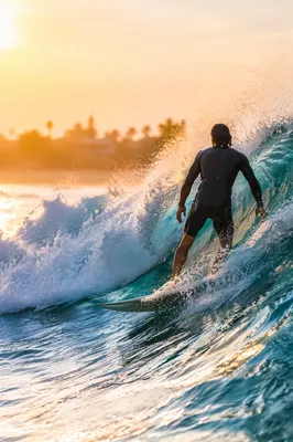Lone Surfer Riding Golden Hour Wave