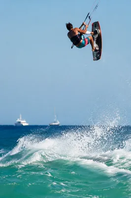 Kitesurfer Flying Above Summer Ocean Wave