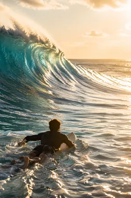 Surfer Paddling Toward Turquoise Morning Wave