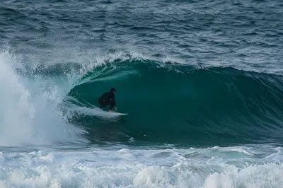 Surfer Carving Inside Turquoise Ocean Wave