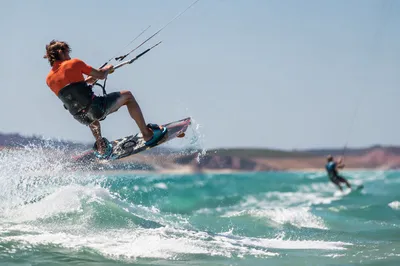 Kitesurfer Jumping Over Turquoise Summer Waves