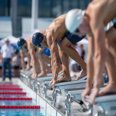 Competitive Swimmers Ready at Pool Start