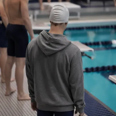 Competitive Swimmer Waiting by Indoor Pool