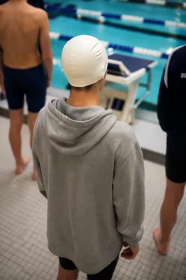 Swimmer Waiting by Indoor Competition Lanes