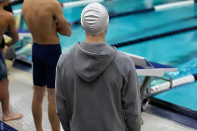 Swimmer Waiting Beside Indoor Competition Lanes