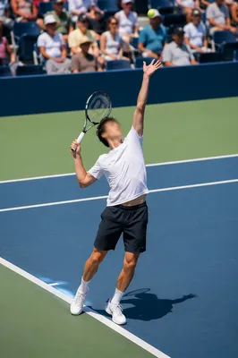 Tennis Player Mid Serve on Outdoor Court