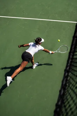 Overhead Tennis Match on Green Court