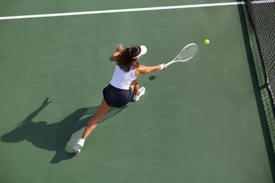 Overhead Tennis Match on Green Court