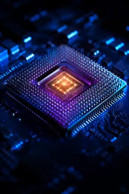 Glowing AI Microprocessor on Dark Circuit Board