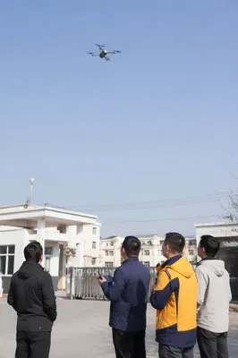 Autonomous Drone Over Modern Campus Entrance