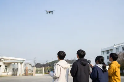Autonomous Drone Over Modern Campus Entrance
