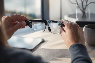 Hands Adjusting Augmented Reality Glasses