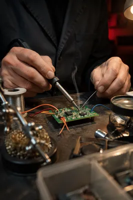 Macro Soldering on Green Circuit Board