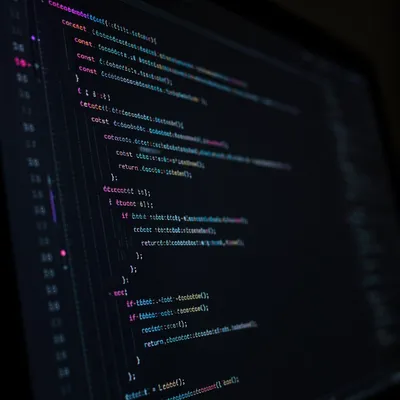 Dark Coding Screen With Neon Syntax Glow