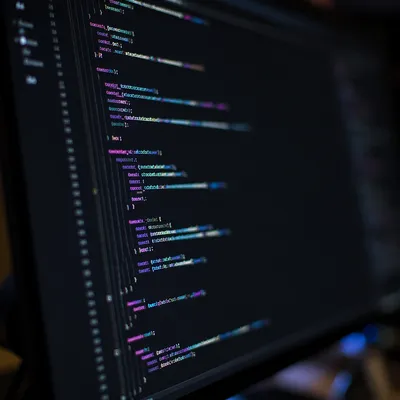 Dark Coding Screen With Neon Syntax