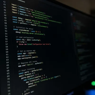 Dark Programming Code on Glowing Monitor