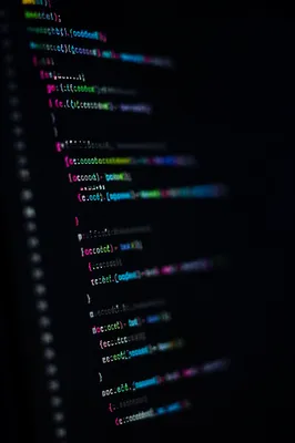 Late Night Coding Screen in Dark Workspace