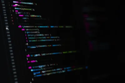 Late Night Coding on Dark Monitor