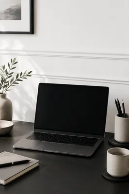 Minimal Modern Laptop Workspace on White Desk