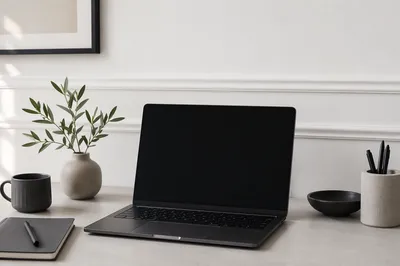 Minimal Modern Laptop Workspace on White Desk