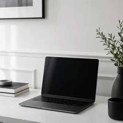 Minimalist Modern Laptop Workspace on White Desk