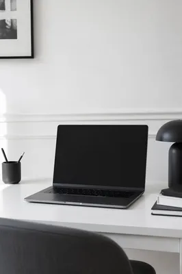 Minimalist Modern Laptop Workspace on White Desk