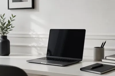 Modern Laptop Workspace on White Desk