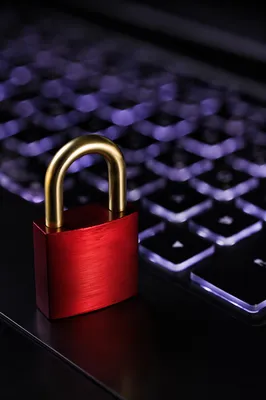 Red Padlock on Backlit Laptop Keyboard