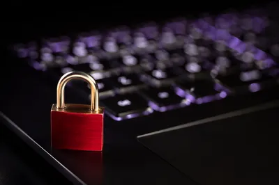 Red Padlock on Backlit Laptop Keyboard
